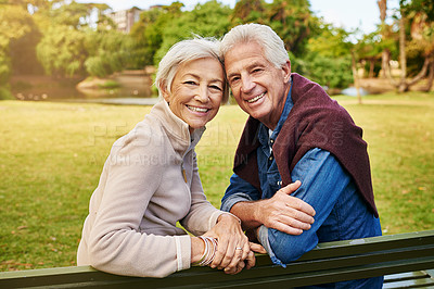 Buy stock photo Portrait of a happy senior couple sitting on a park bench