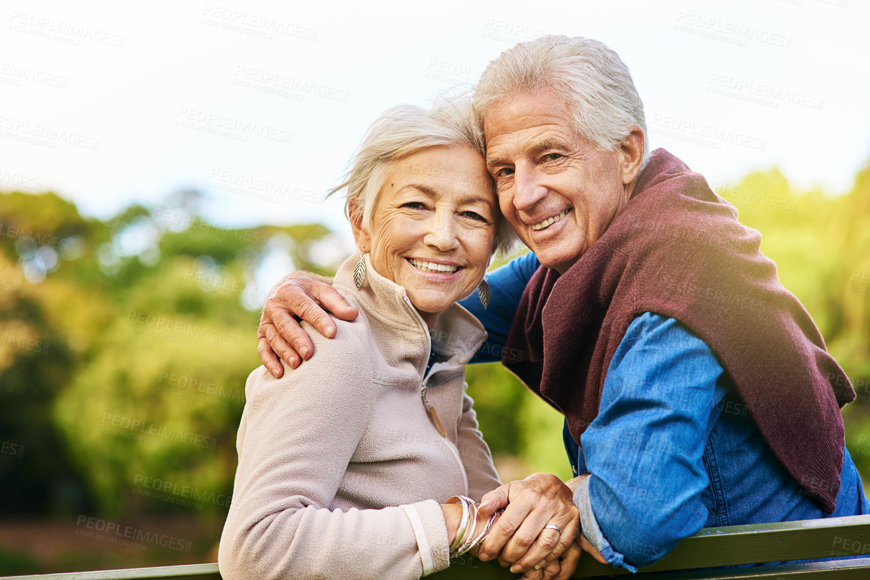 Buy stock photo Old couple in portrait, relax in the park with smile, happiness together with bonding in nature, love and retirement. Happy, man and woman with travel, relationship with marriage and commitment