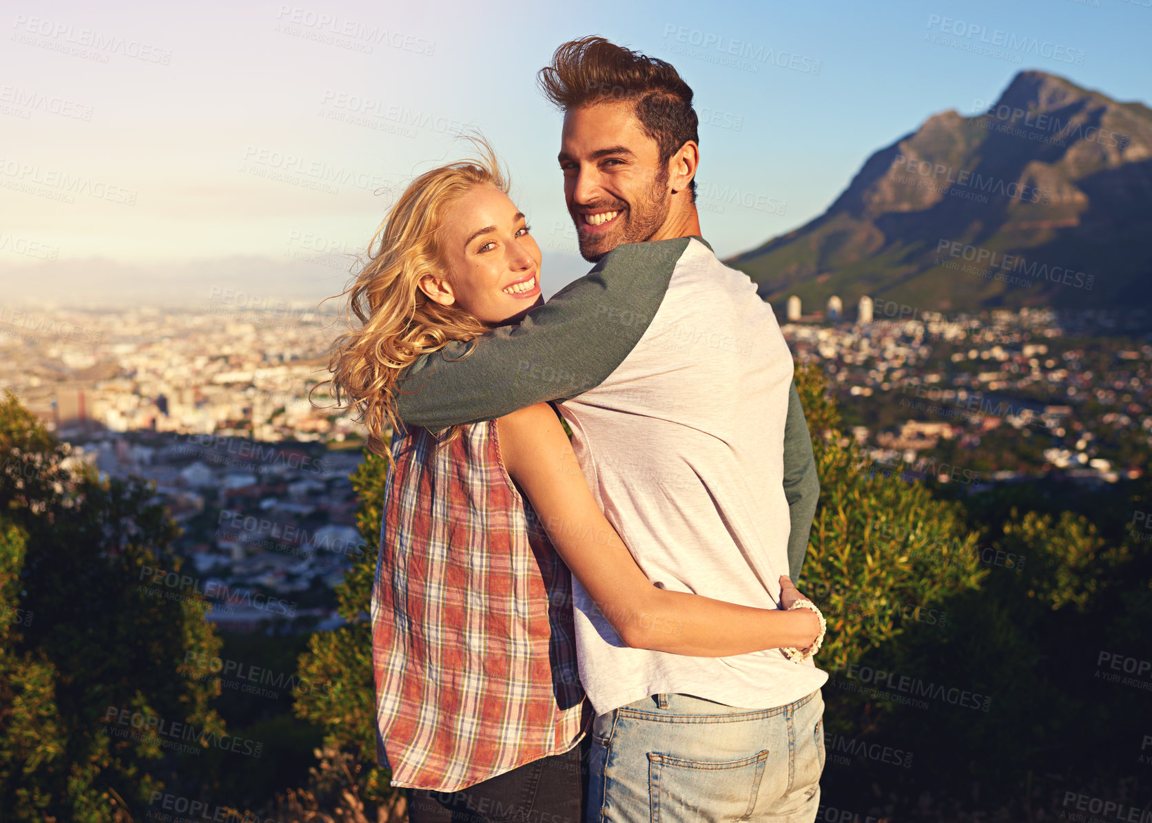 Buy stock photo Portrait of an affectionate young couple outdoors