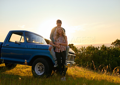 Buy stock photo Couple, portrait and sunset by pickup truck in nature for road trip with love, romance and date on adventure. Man, woman and hug for freedom, journey and transportation for travel in countryside