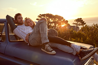 Buy stock photo Shot of an affectionate young couple on a roadtrip