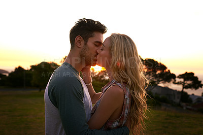 Buy stock photo Couple kissing, nature and trees in sunset with love, romance and date on adventure, travel or honeymoon. Man,  woman and kiss with hug, care and outdoor for safari, travel or travel in countryside
