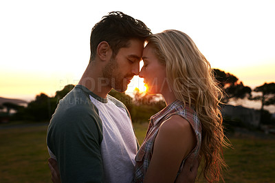 Buy stock photo Sunset, love or couple in nature on romantic holiday vacation for bonding or relaxing on date together. Forehead, travel or people hug or embrace in summer with romance or peace in park in the dark