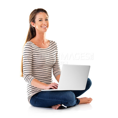 Buy stock photo Studio portrait of a young woman using a laptop against a white background