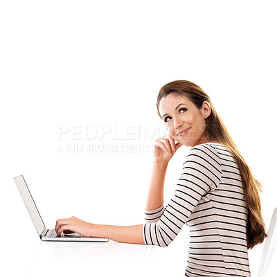 Buy stock photo Studio shot of a young woman using a laptop against a white background