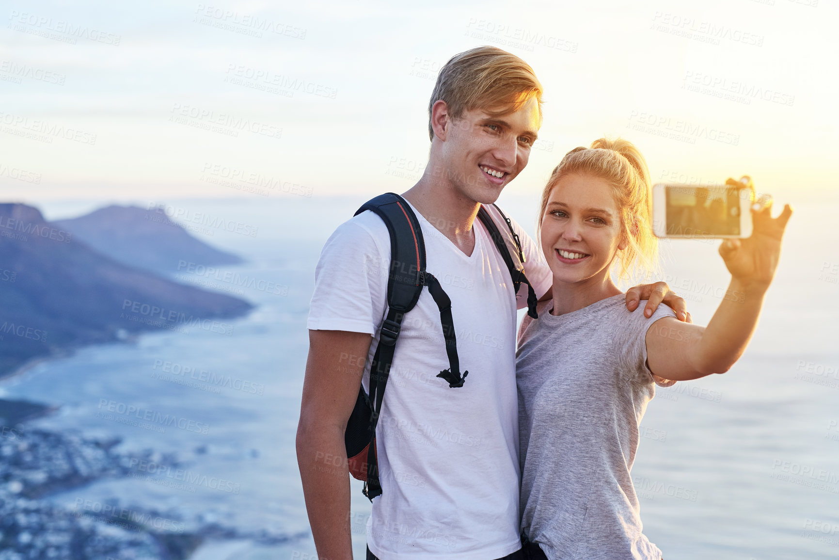 Buy stock photo Man, woman and hiking on mountain with selfie for travel blog, social media and online post. Happy, couple and smile with digital photography in nature for fitness, update and memory of adventure