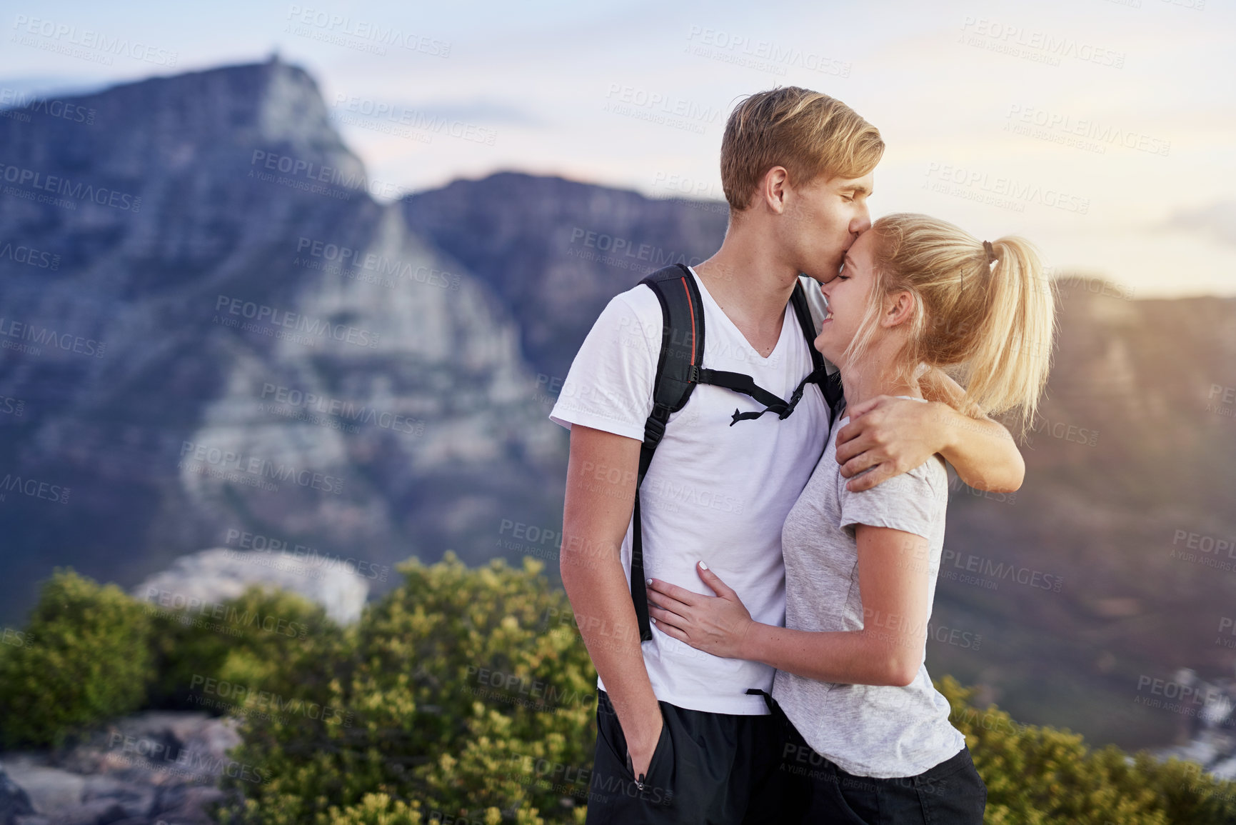 Buy stock photo Cropped shot of a young couple on a hike