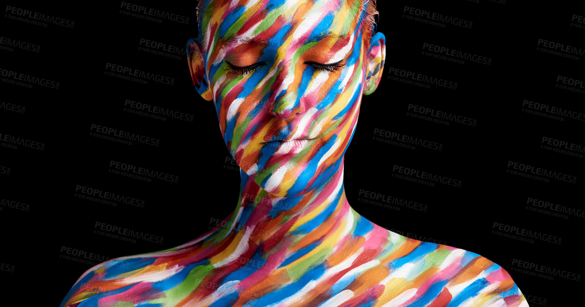 Buy stock photo Cropped shot of a young woman posing with paint on her face