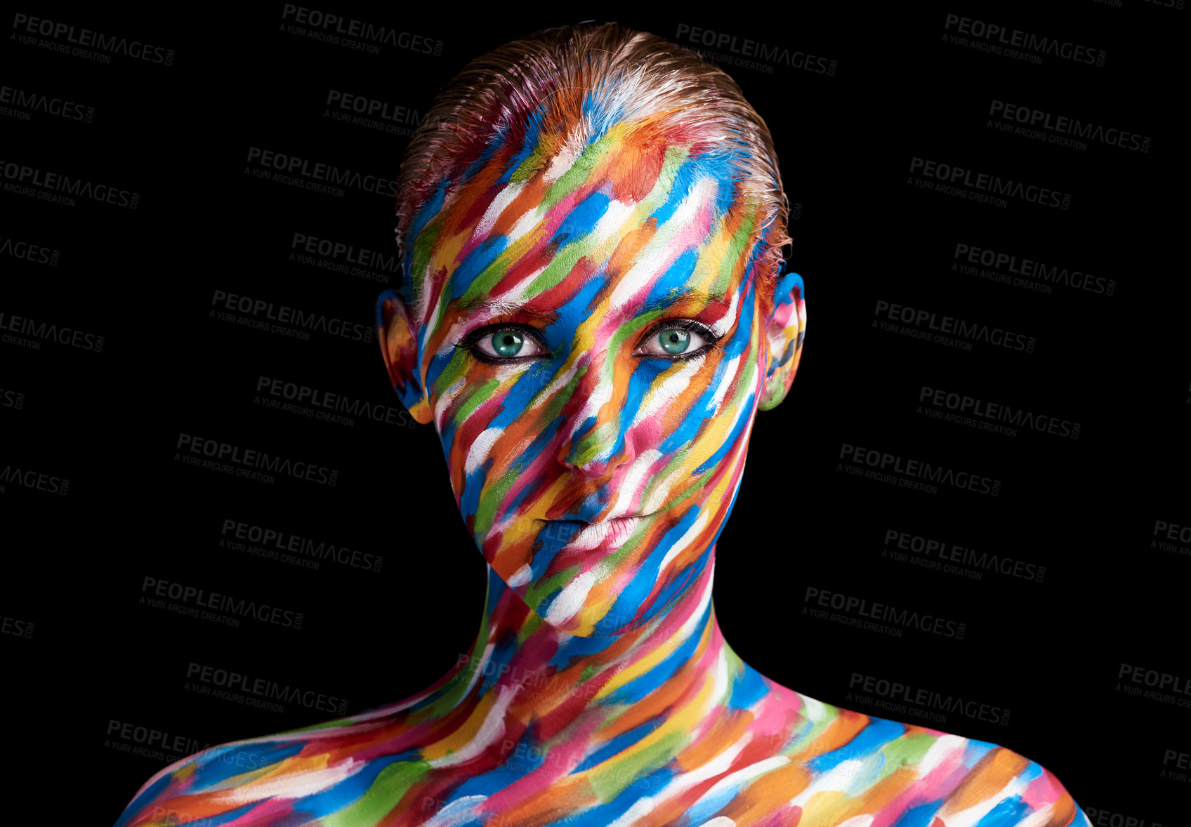 Buy stock photo Cropped portrait of a young woman posing with paint on her face