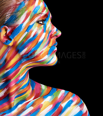 Buy stock photo Cropped shot of a young woman posing with paint on her face