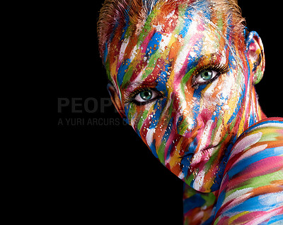 Buy stock photo Cropped portrait of a young woman posing with paint on her face