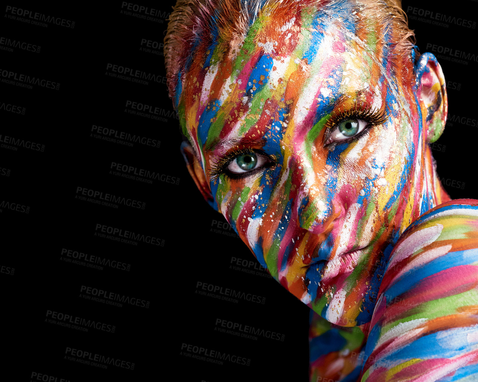 Buy stock photo Cropped portrait of a young woman posing with paint on her face