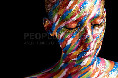 Buy stock photo Cropped shot of a young woman posing with paint on her face