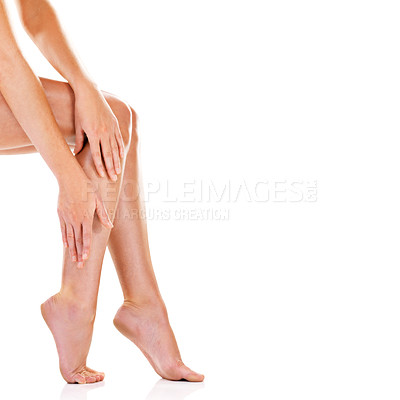 Buy stock photo Woman, legs and body care in studio, smooth and skincare for grooming skin on white background. Female person, mockup space and cosmetics treatment or hair removal, epilation and feet for hygiene