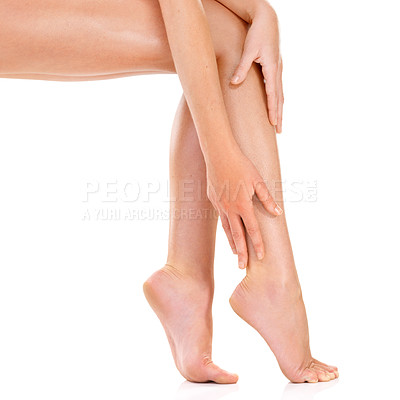 Buy stock photo Woman, legs and body care in studio, touch and skincare for smooth skin on white background. Female person, mockup space and cosmetics treatment or dermatology, self care and grooming for hygiene