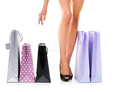 Buy stock photo Shopping, bags and legs of woman at fashion sale with discount, giveaway or boutique offer in studio. Gift, product and feet of girl with retail, designer clothes and customer on white background.
