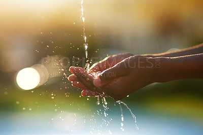 Buy stock photo Closeup shot of hands held out under a stream of water