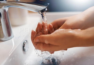 Buy stock photo Closeup shot of a hands being washed at a tap