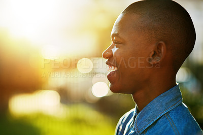 Buy stock photo Cropped shot of a young man outside on a summer's day