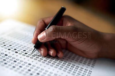 Buy stock photo Cropped shot of a person filling out a multiple choice questionnaire