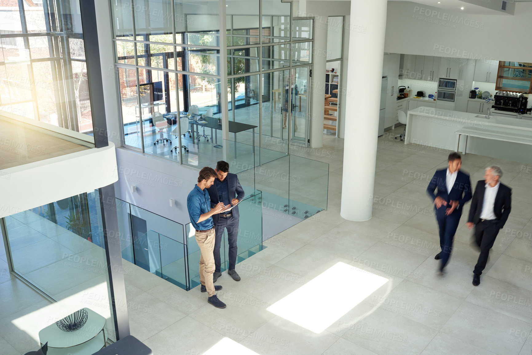 Buy stock photo Shot of a businesspeople at work in a large modern office