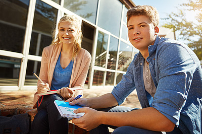 Buy stock photo Shot of two students studying together on campus