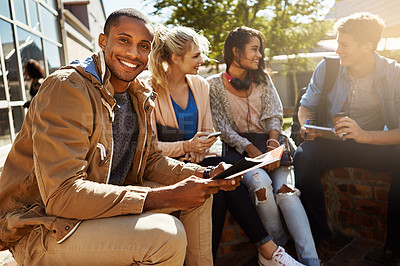 Buy stock photo Portrait of a student studying outside on campus with his classmates