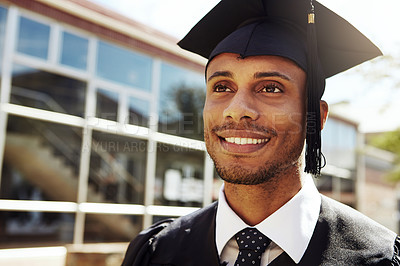 Buy stock photo Shot of a smiling university student outside on graduation day
