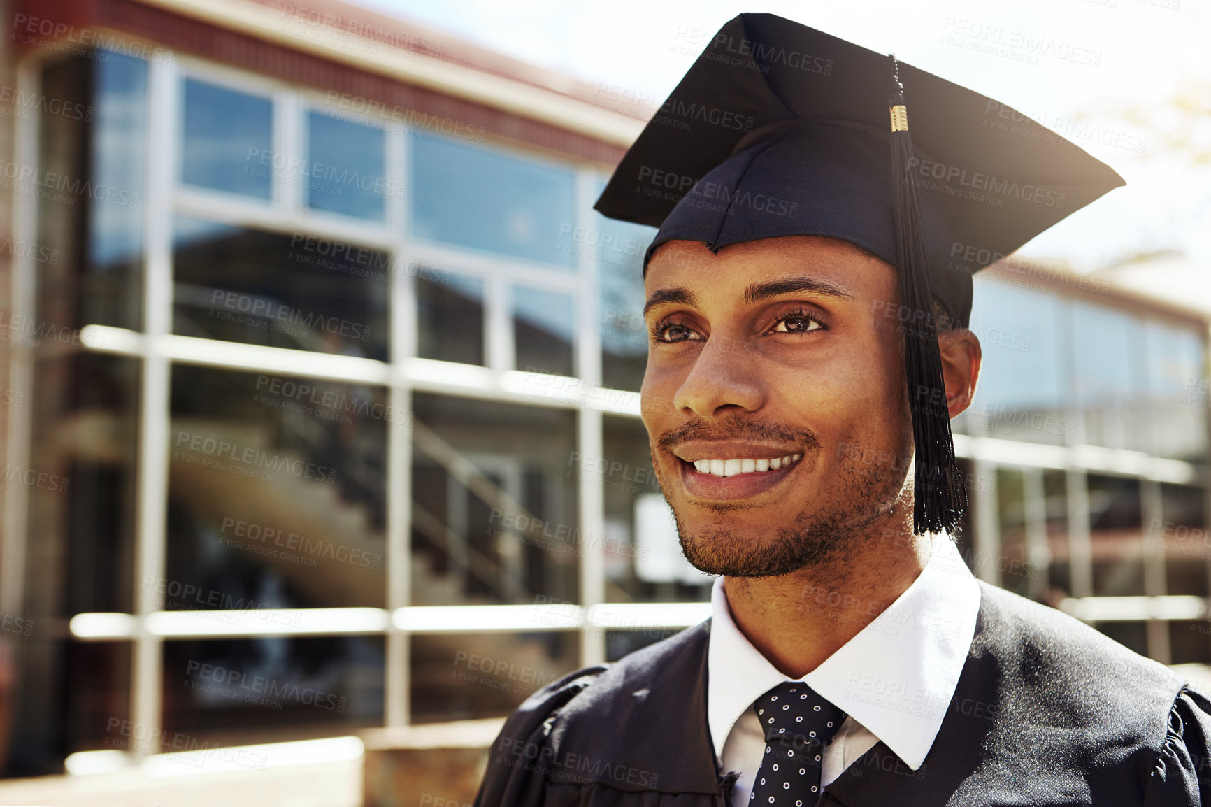 Buy stock photo Thinking, smile and graduation for man, education and happy for achievement, future and ceremony. Outdoor, joy and contemplating for accomplishment, knowledge and event for milestone and black person