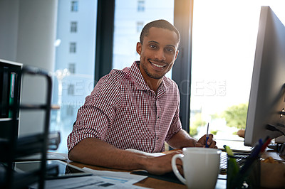 Buy stock photo Portrait of a businessman working on a computer in an office
