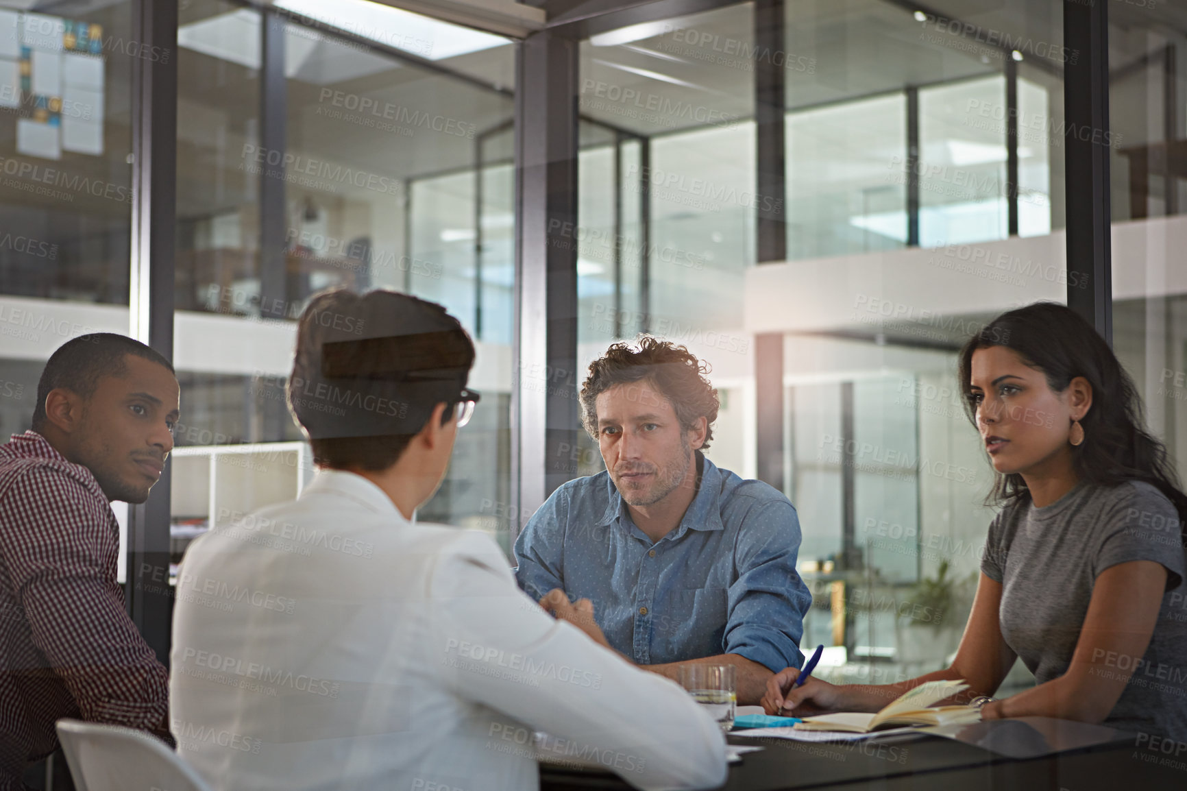 Buy stock photo Cropped shot of a group of colleagues meeting in the office