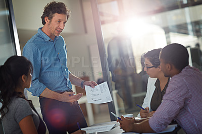Buy stock photo Cropped shot of a group of colleagues meeting in the office