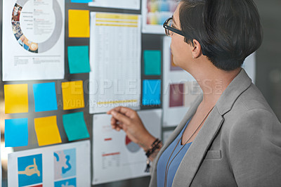 Buy stock photo Cropped shot of a businesswoman working in her office