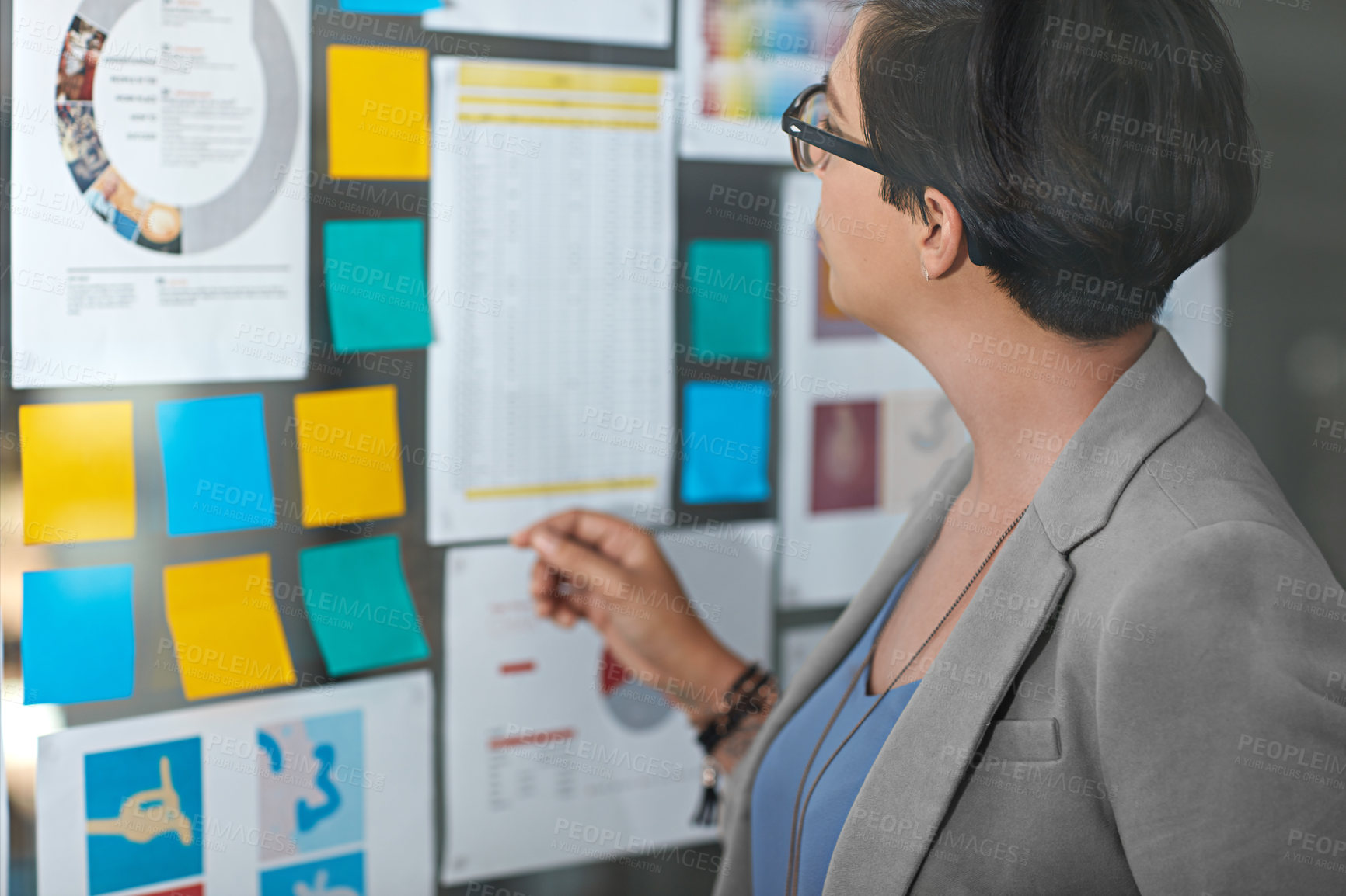 Buy stock photo Woman, sticky notes and office for thinking on agenda, problem solving and vision for campaign. Female person, contemplating statistics and glass wall for solution, brainstorming and mood board