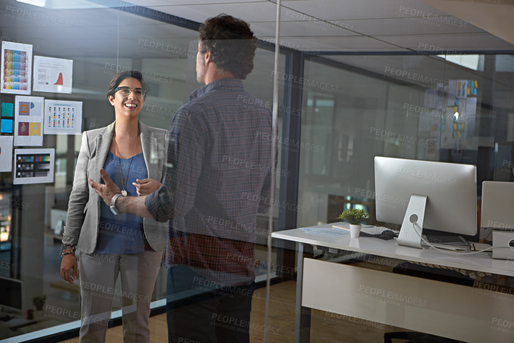 Buy stock photo Cropped shot of two businesspeople talking in the office