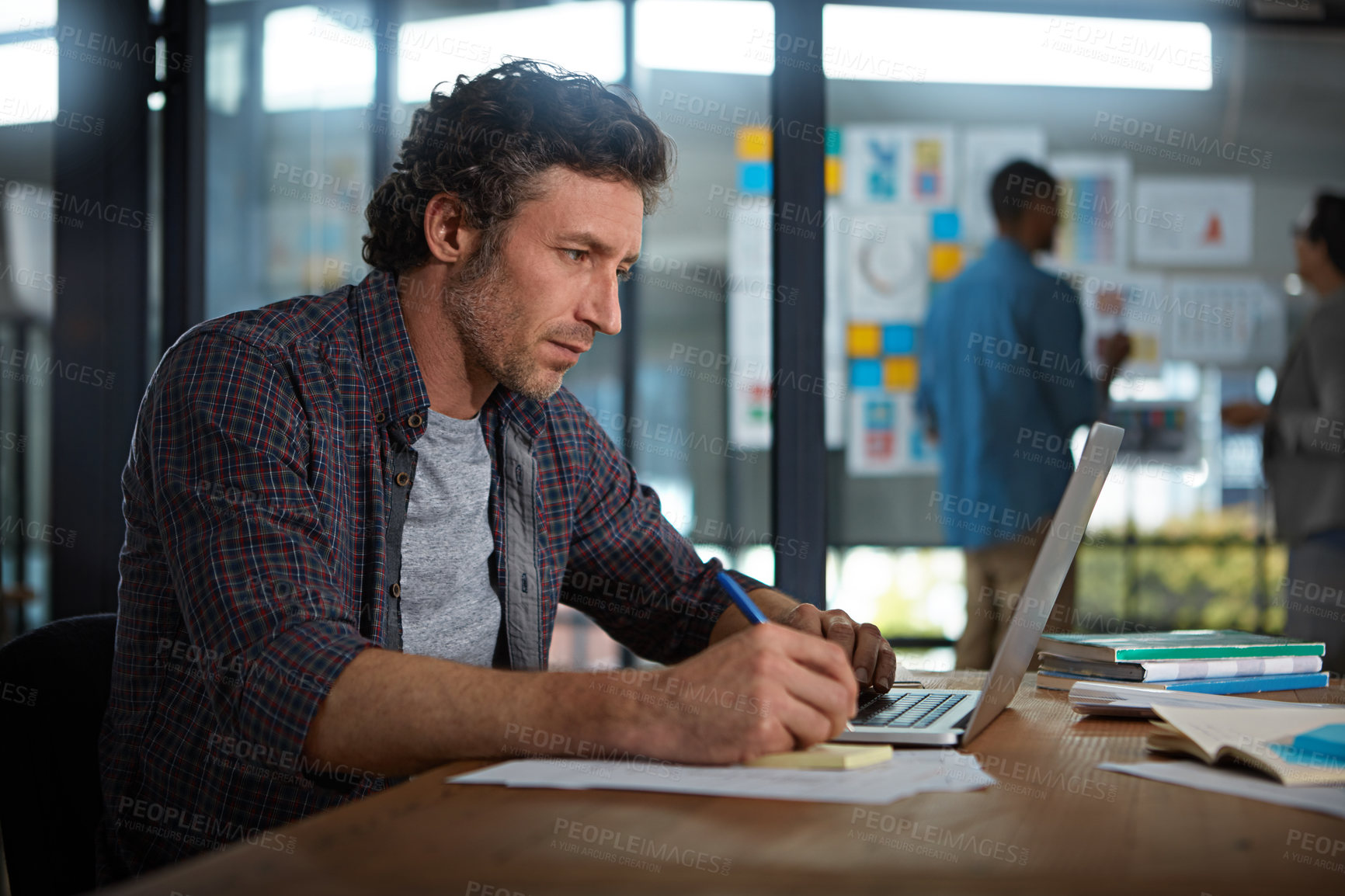 Buy stock photo Cropped shot of a businessman working in his office