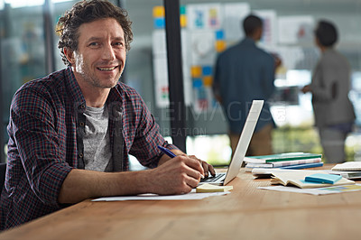 Buy stock photo Cropped portrait of a businessman working in his office