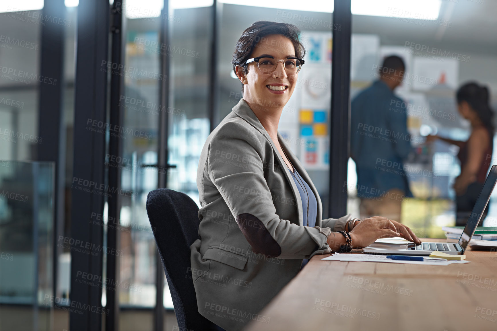 Buy stock photo Cropped portrait of a businesswoman working in her office