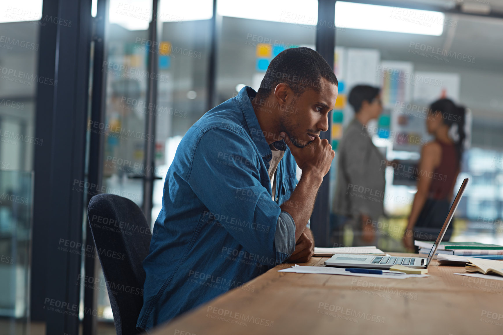 Buy stock photo Cropped shot of a businessman working in his office