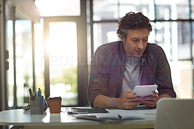 Buy stock photo Cropped shot of a businessman working in his office