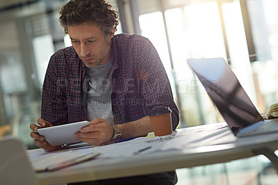 Buy stock photo Cropped shot of a businessman working in his office