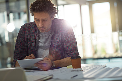 Buy stock photo Cropped shot of a businessman working in his office