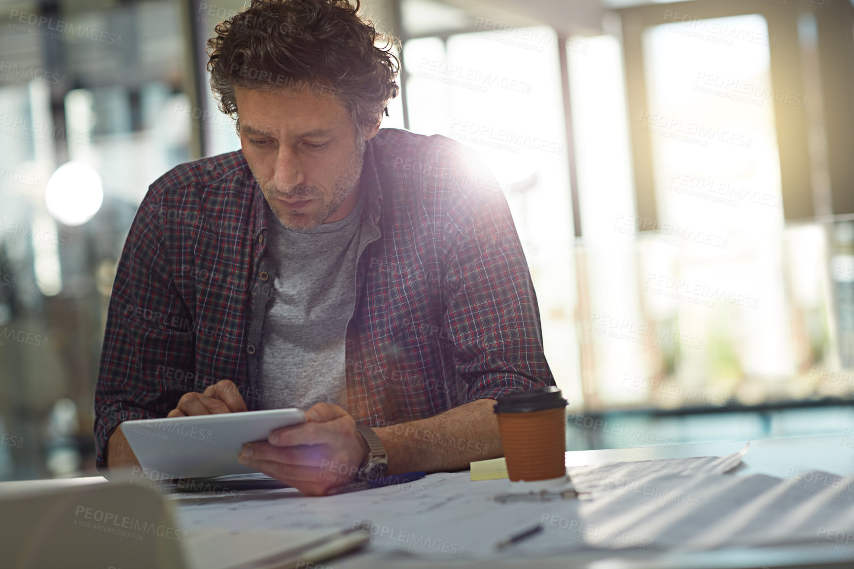 Buy stock photo Cropped shot of a businessman working in his office