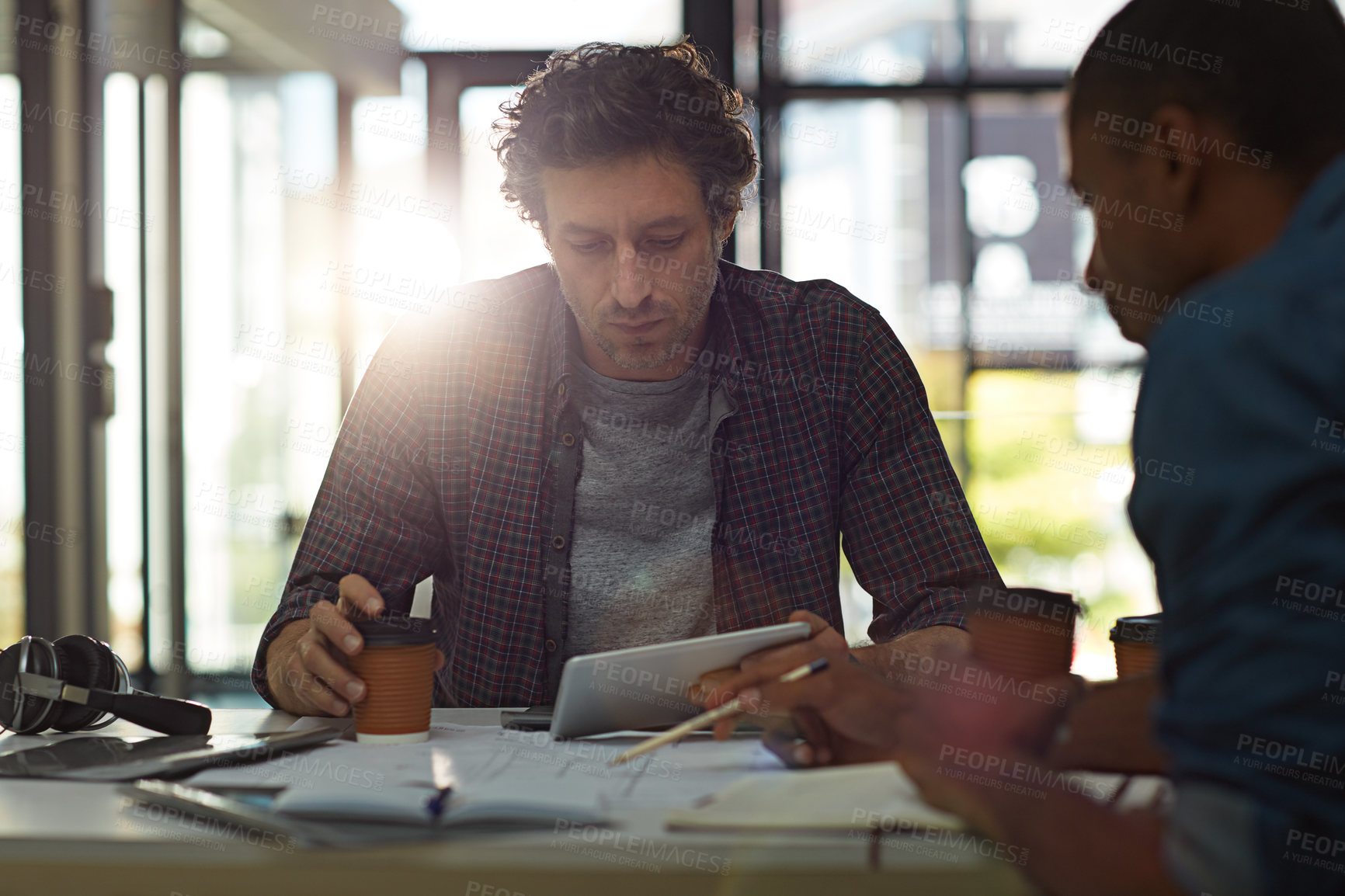 Buy stock photo Cropped shot of two businessmen talking in the office