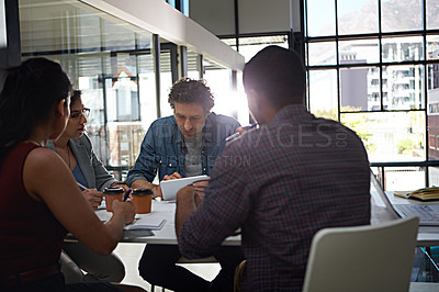 Buy stock photo Cropped shot of a group of colleagues meeting in the office