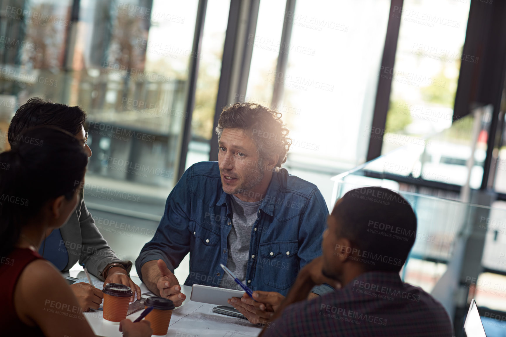 Buy stock photo Business people, tablet and diversity in team, meeting or feedback for employee engagement in office. Technology, group and discussion for collaboration, review and communication in creative agency