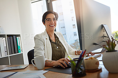 Buy stock photo Portrait of a businesswoman working on a computer in an office