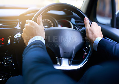 Buy stock photo Shot of a businessman driving his car