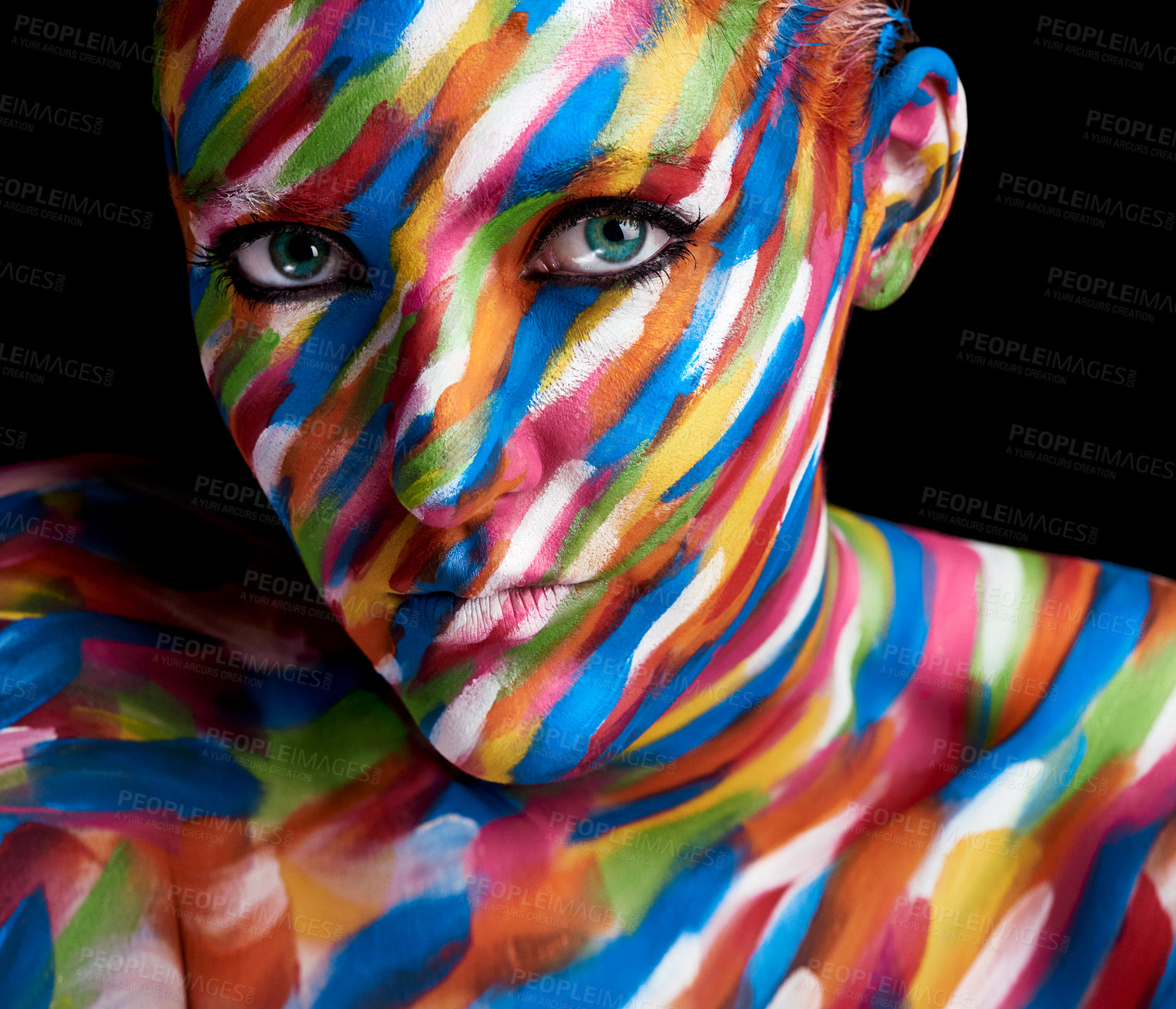 Buy stock photo Cropped portrait of a young woman posing with paint on her face