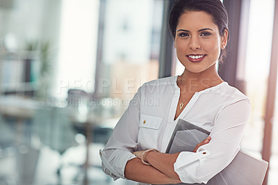 Buy stock photo Portrait of a young businesswoman standing in an office